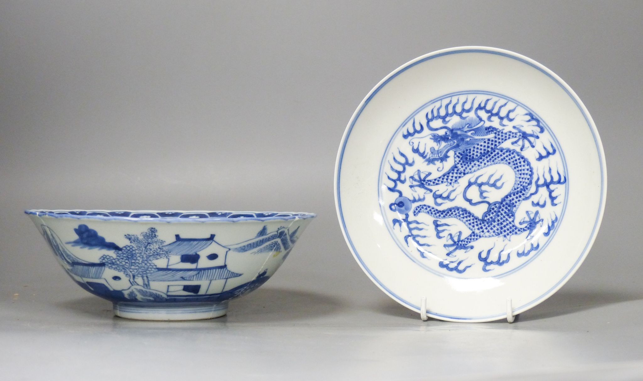 A Chinese blue and white landscape bowl, a/f and a Chinese blue and white ‘dragon’ dish, 18 and 16.5 cm